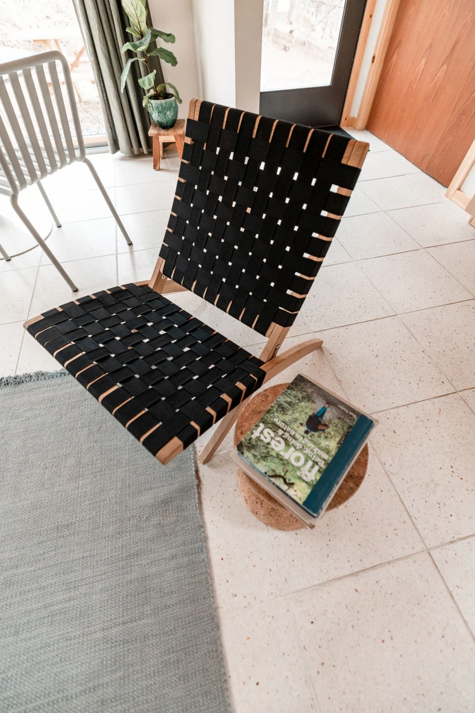 Folding chair beside a small side table