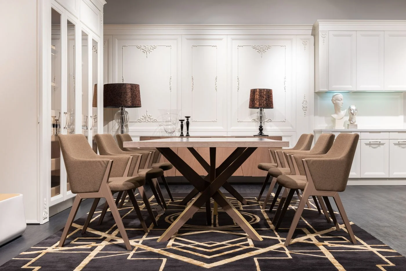 Dining table and chairs standing on a rug