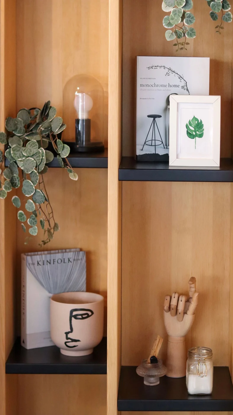 Decorative objects spaced on open shelves