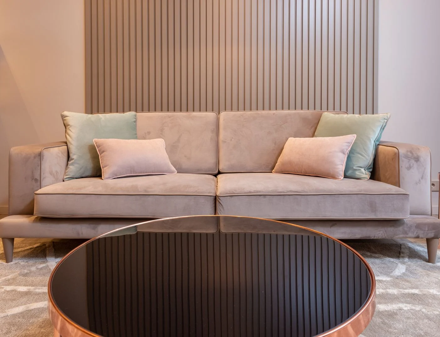 Round coffee table in front of a sofa