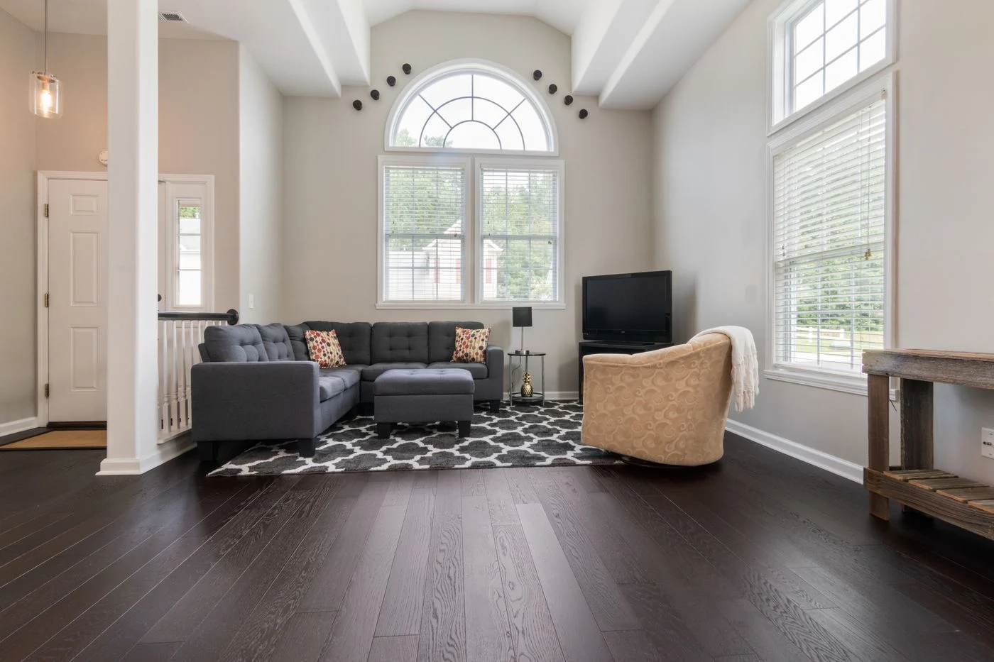 Furniture arranged in a high-ceiling living room