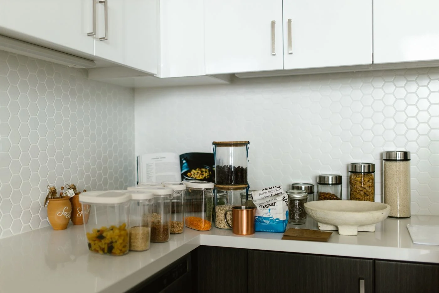 Food containers and jars on a kitchen counter