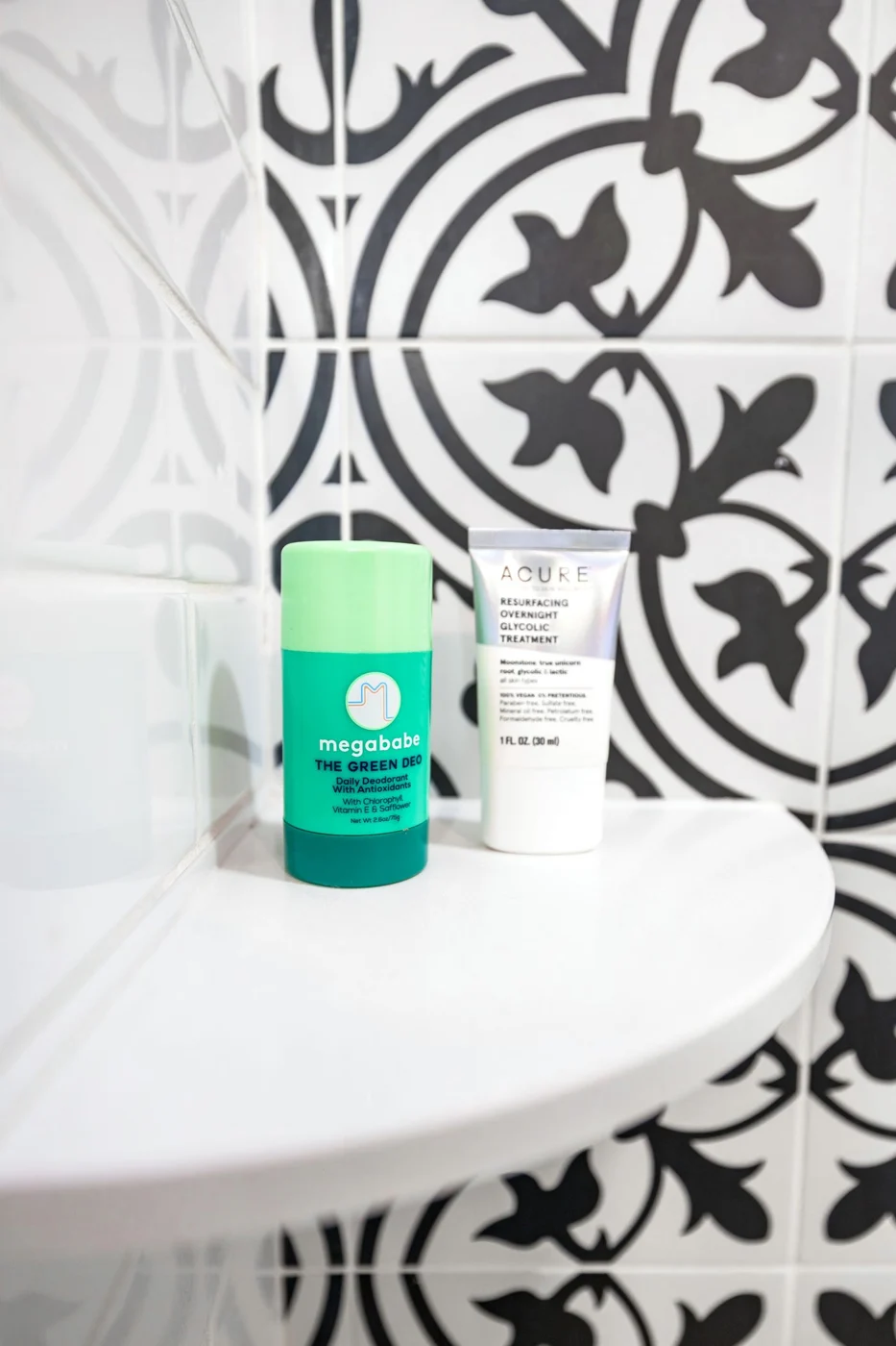 Toiletries on a small bathroom shelf