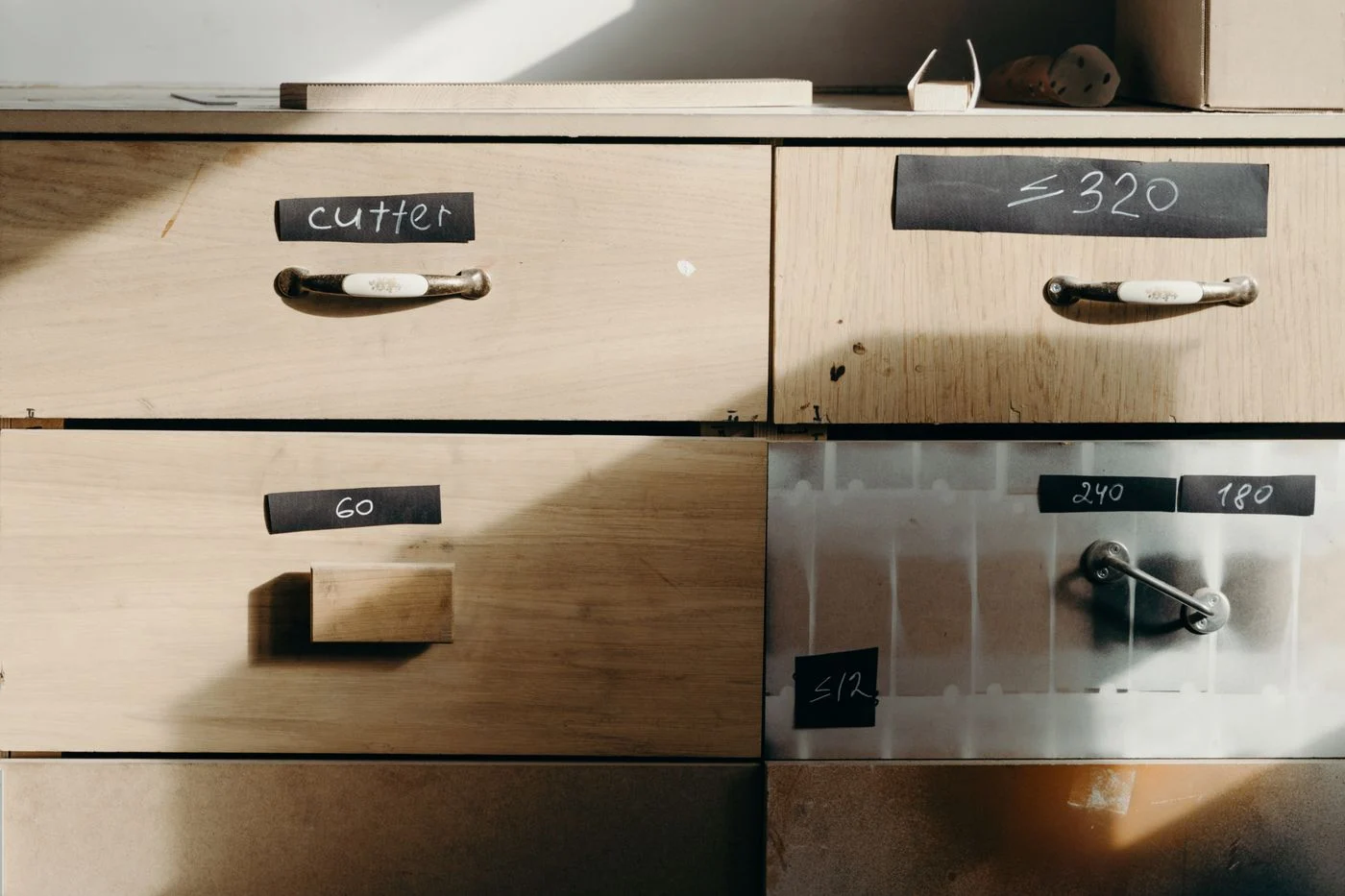 Labels on wooden storage drawers