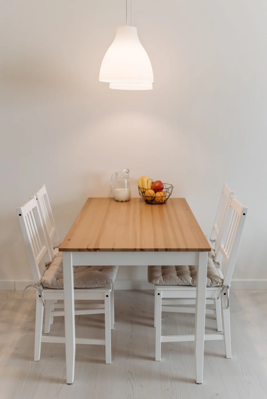 Pendant light over a wooden dining table