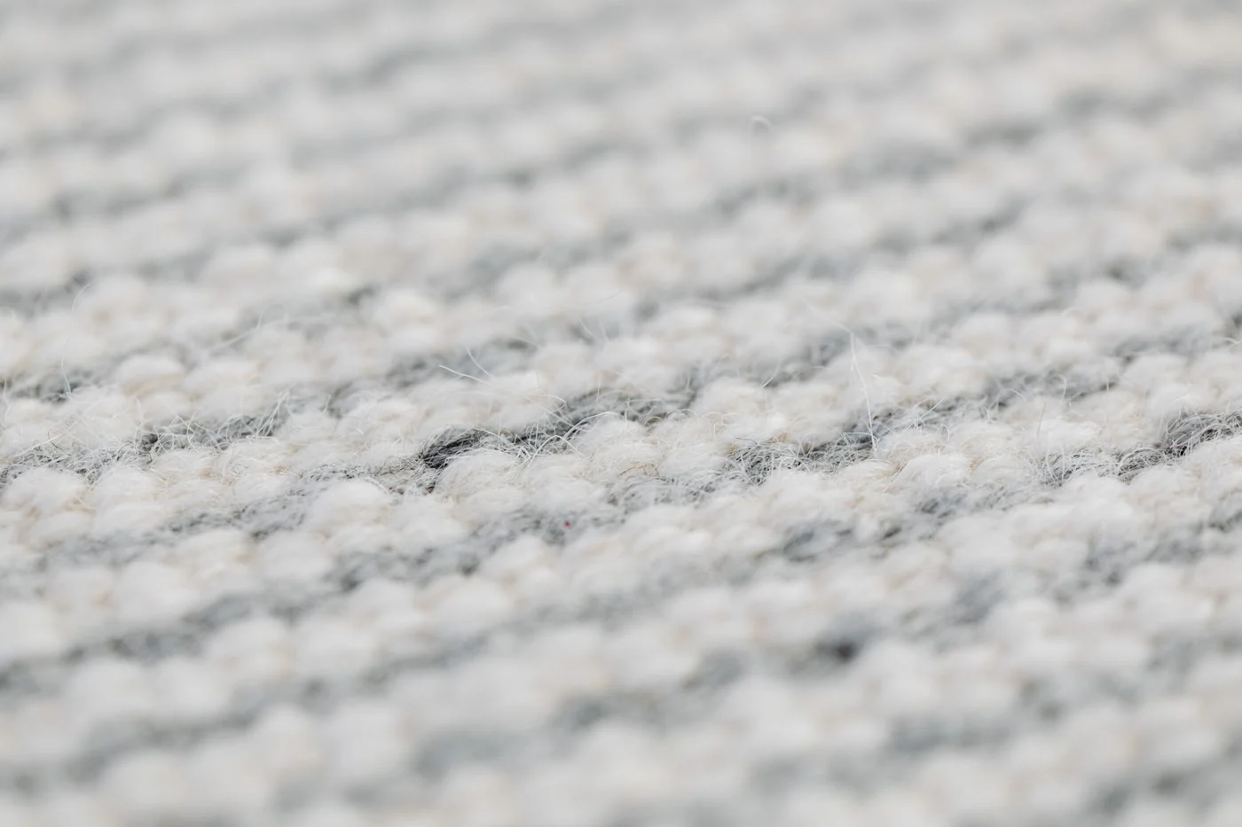 Close view of the woven texture of a rug