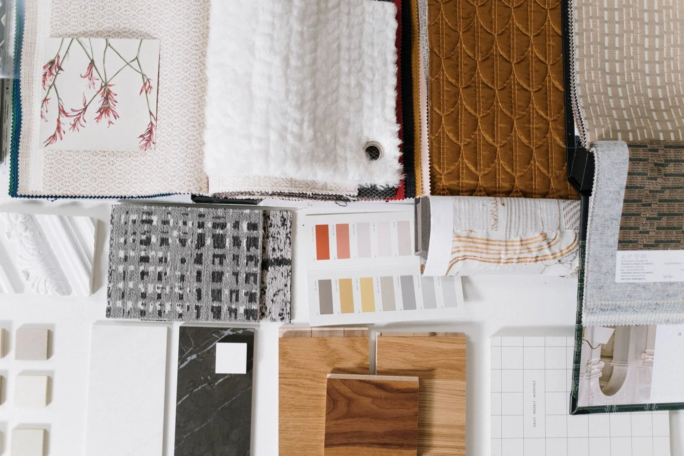 Textile samples arranged with colour swatches