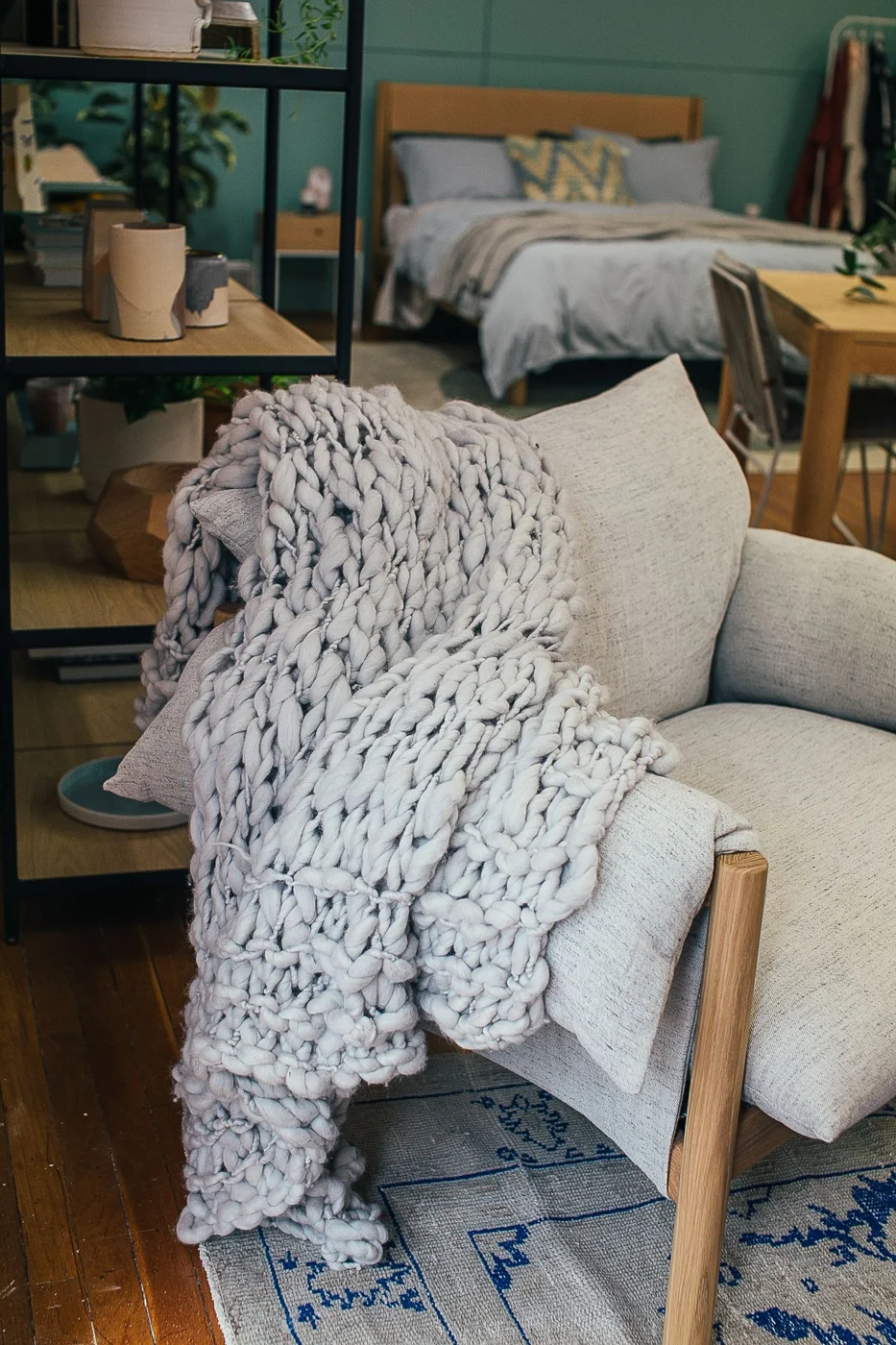 Knitted throw draped over an armchair