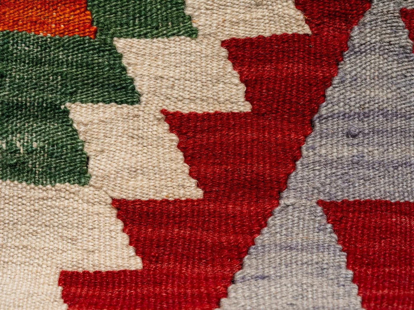Woven textile with coloured geometric patterns