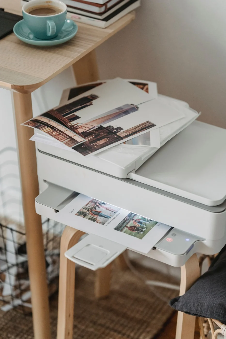 Printer positioned on a wooden work surface