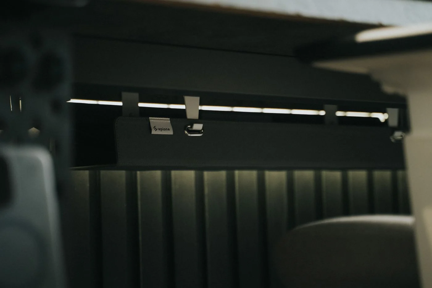 Cable management fitted beneath a desk