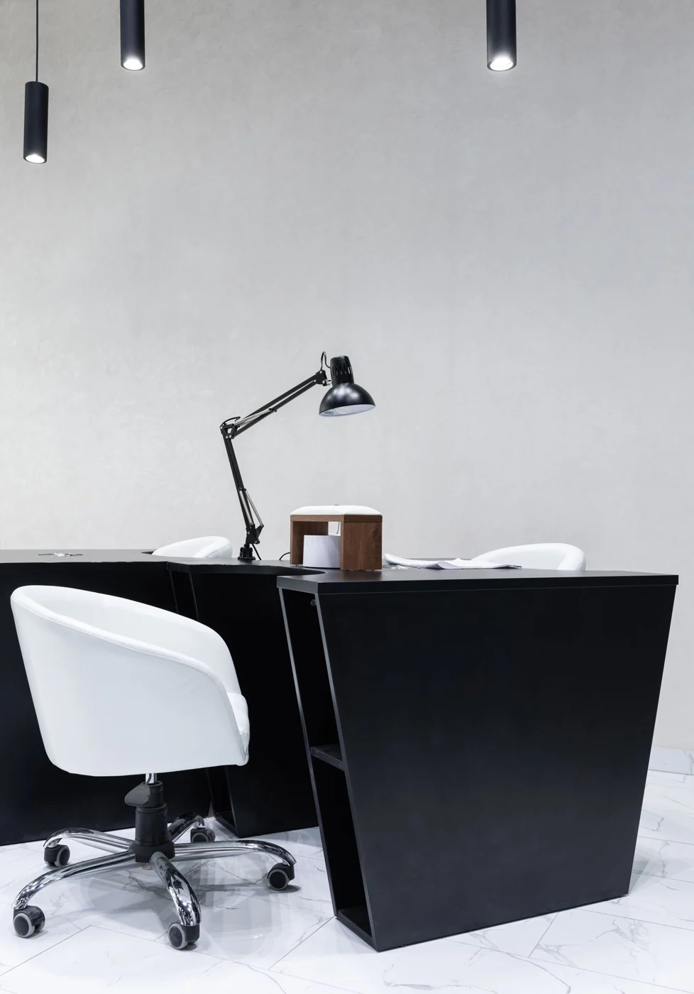 Adjustable task lamp on a desk in a lit room