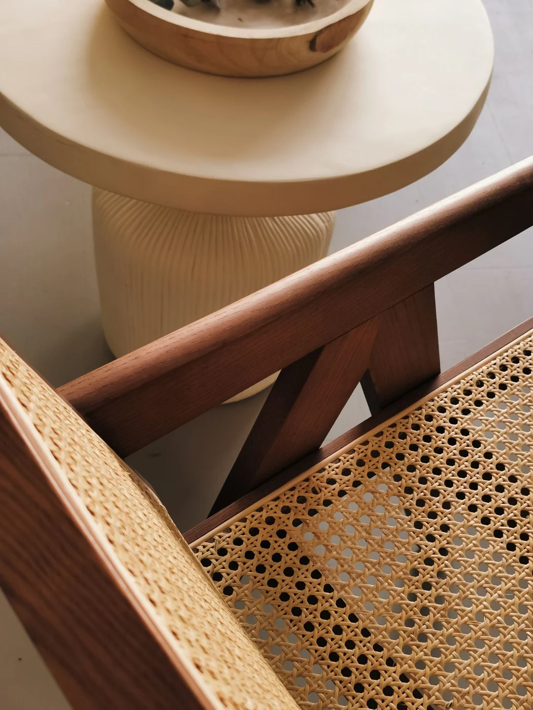 Woven rattan chair and a wooden side table