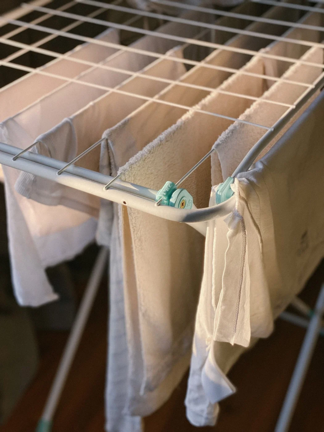 Household textiles drying on an indoor rack